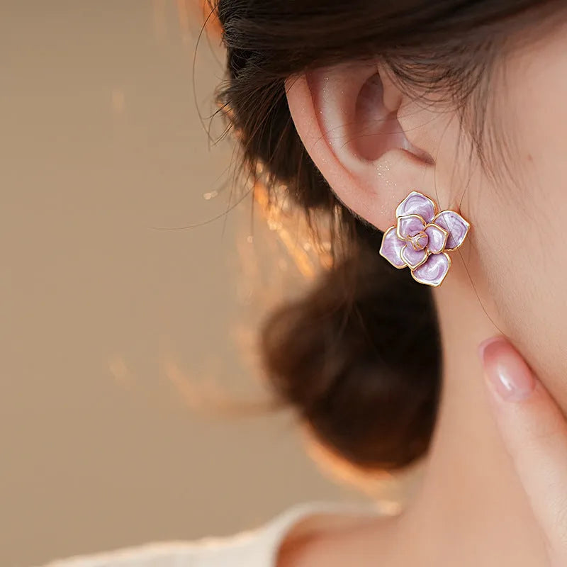 Gold plated purple floral stud earrings with oil-spot glaze on copper