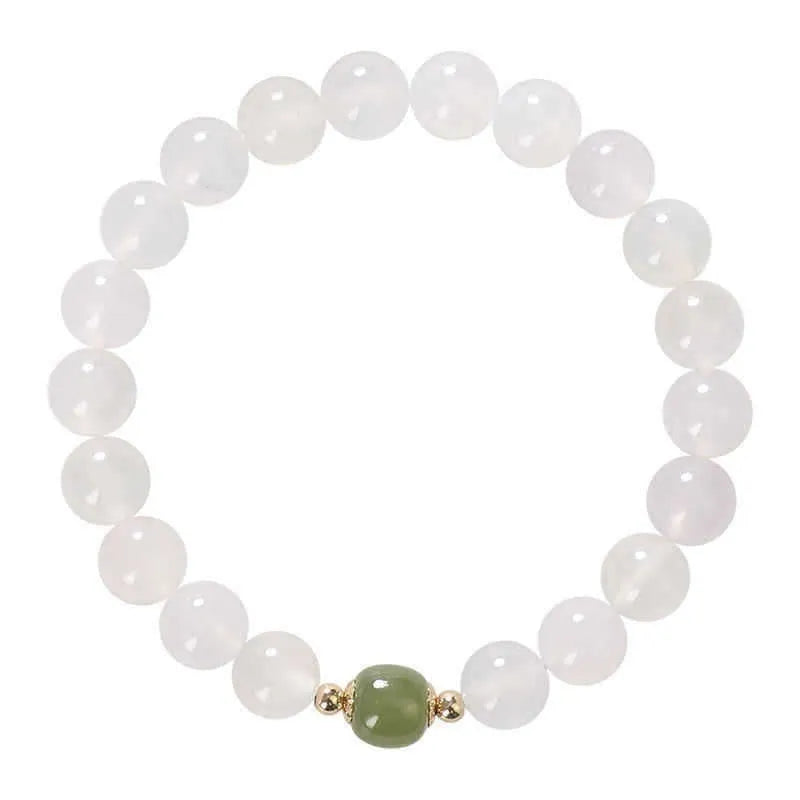 Handmade white agate and crystal bracelet with cinnabar inlay, showing 6mm or 8mm bead options.