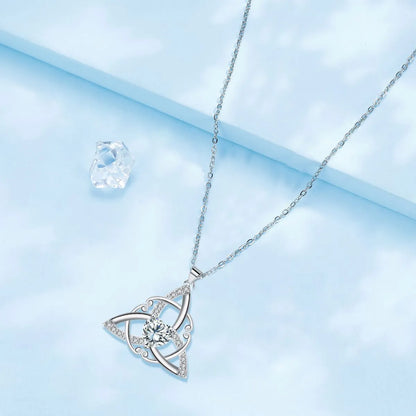 Close-up of a geometric Celtic knot pendant necklace for women in an electroplated blue finish on a copper base.