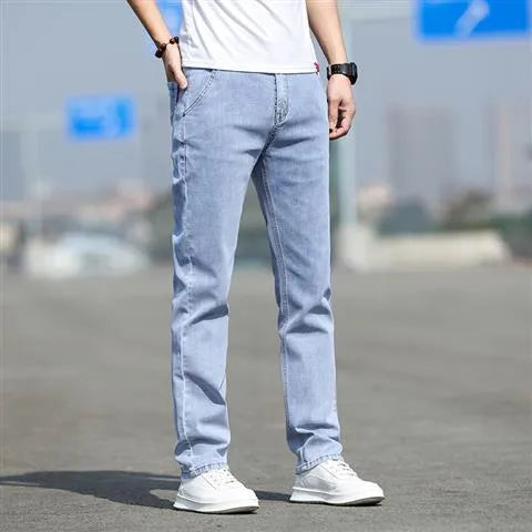 Men's smoky gray straight leg jeans with high elasticity fabric and low waist design