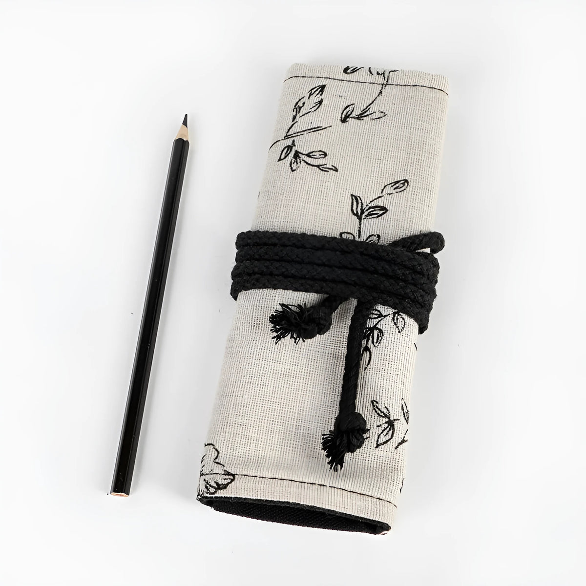 Black Peony printed cotton hemp pencil roll bag unfurled showing 24 or 72 pencil pockets.