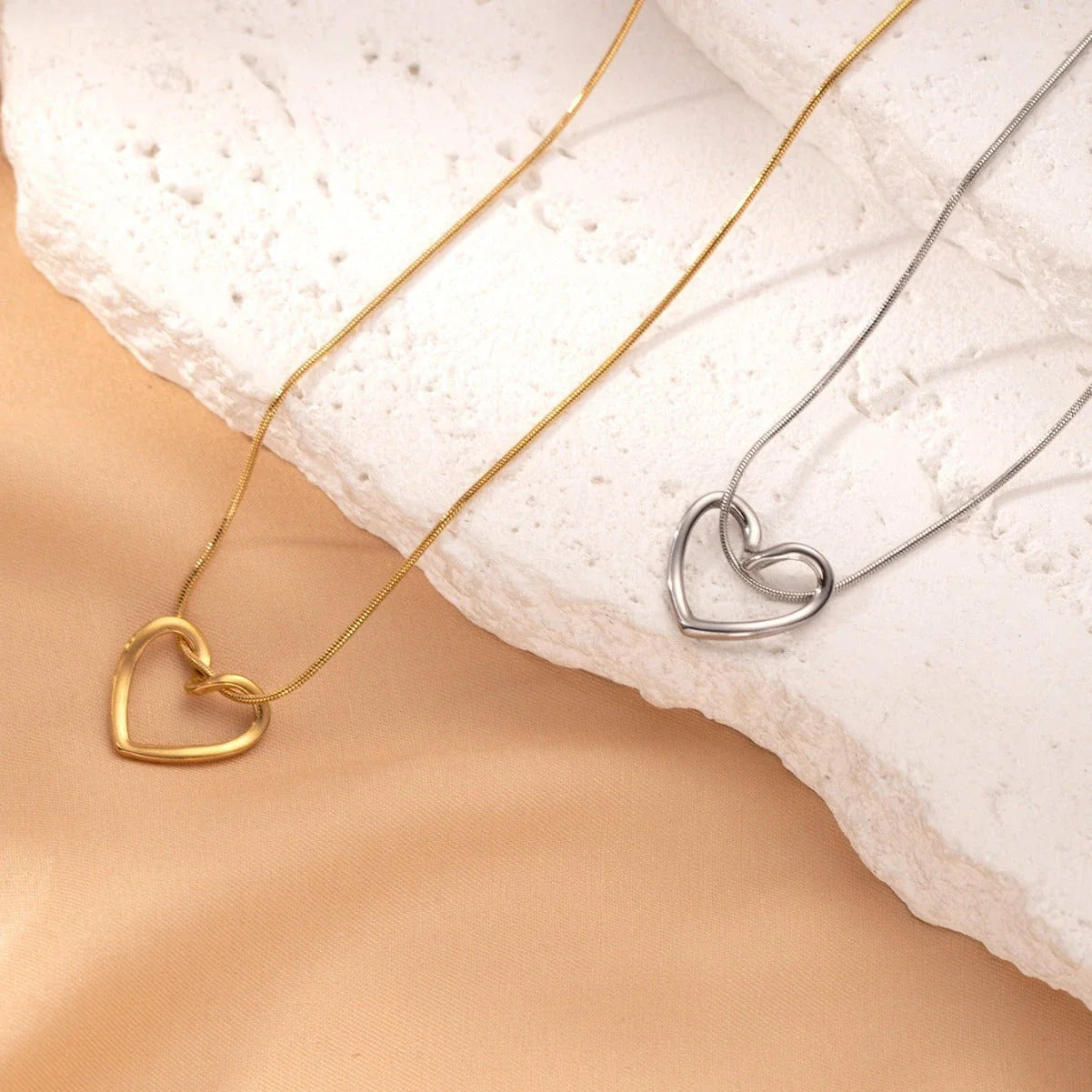 Elegant titanium steel heart pendant necklace with adjustable chain in gold and silver colors