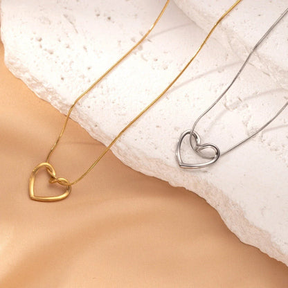 Elegant titanium steel heart pendant necklace with adjustable chain in gold and silver colors