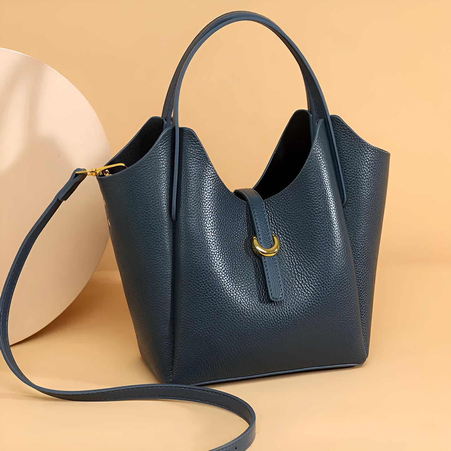 Genuine cowhide leather women's bucket bag in retro style with contrast stitching.