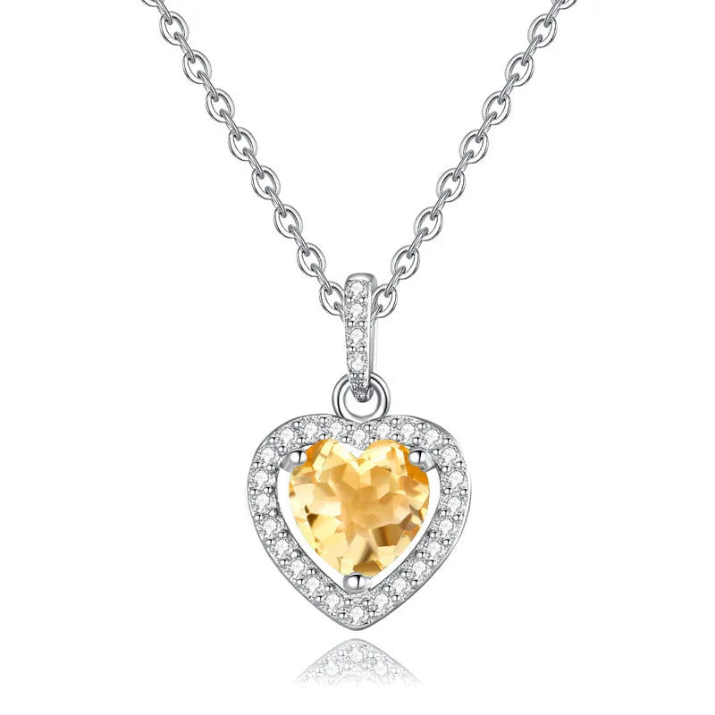 S925 sterling silver necklace with a heart-shaped pendant featuring a round natural gemstone on a cross chain.
