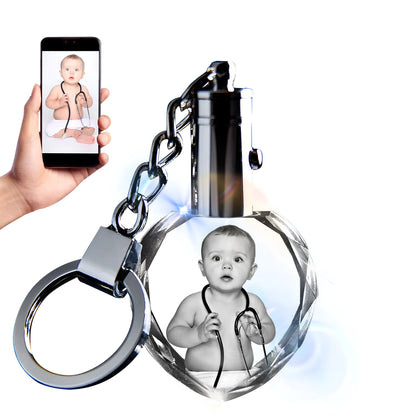 Custom laser-etched crystal photo keychain with internal colourful LED light activated, showing a personalised image.