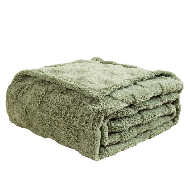 Geometric pattern polyester blanket in dark grey colour draped over sofa