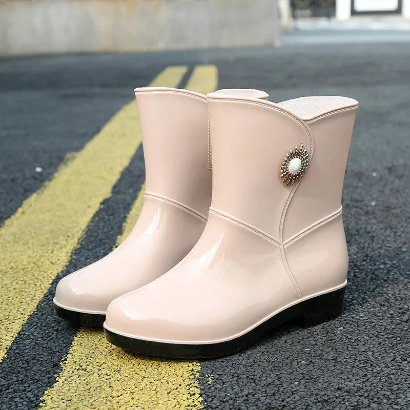 Women's mid-calf rain boots in beige, black, or purple with a non-slip sole.
