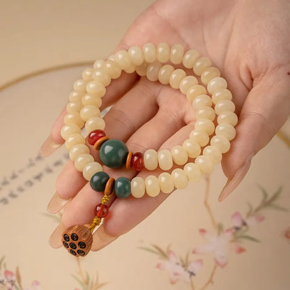 Cream-coloured wooden Bodhi root bracelet with flat round beads on 15-20cm wrist