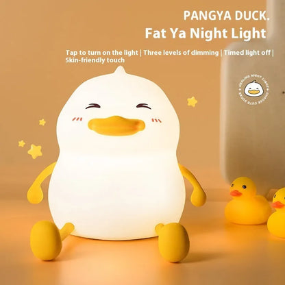 Soft silicone night lamp with phone holder, showing USB-C port and adjustable LED light.