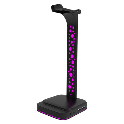 RGB colour changing headset bracket stand with dual USB ports on a desktop