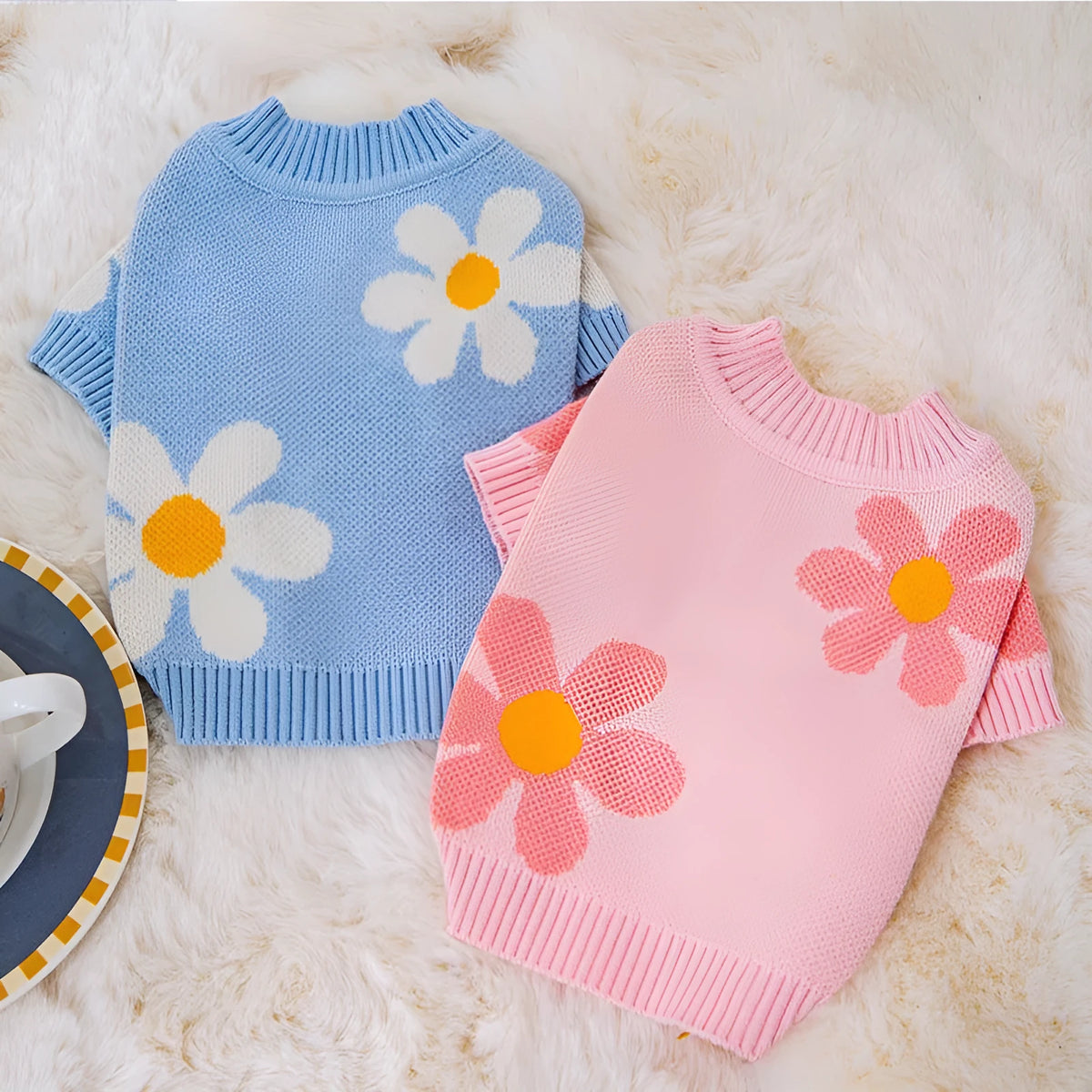 Blue and checkerboard patterned dog coats for small breeds on a white background.