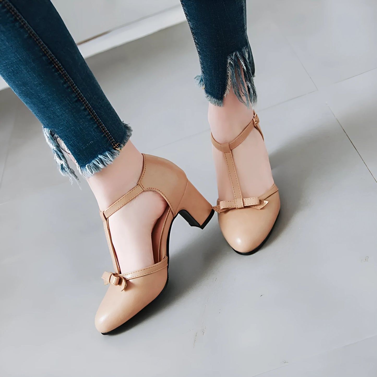 Women's apricot chunky heel sandals with bow tie, hollow-out detail, and an adjustable buckle strap.