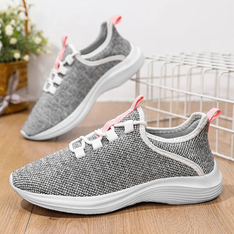 Women's black mesh casual sneakers with lace-up front and lightweight EVA sole