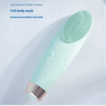 Green electric facial cleaner with silicone brush head, measuring 15cm length