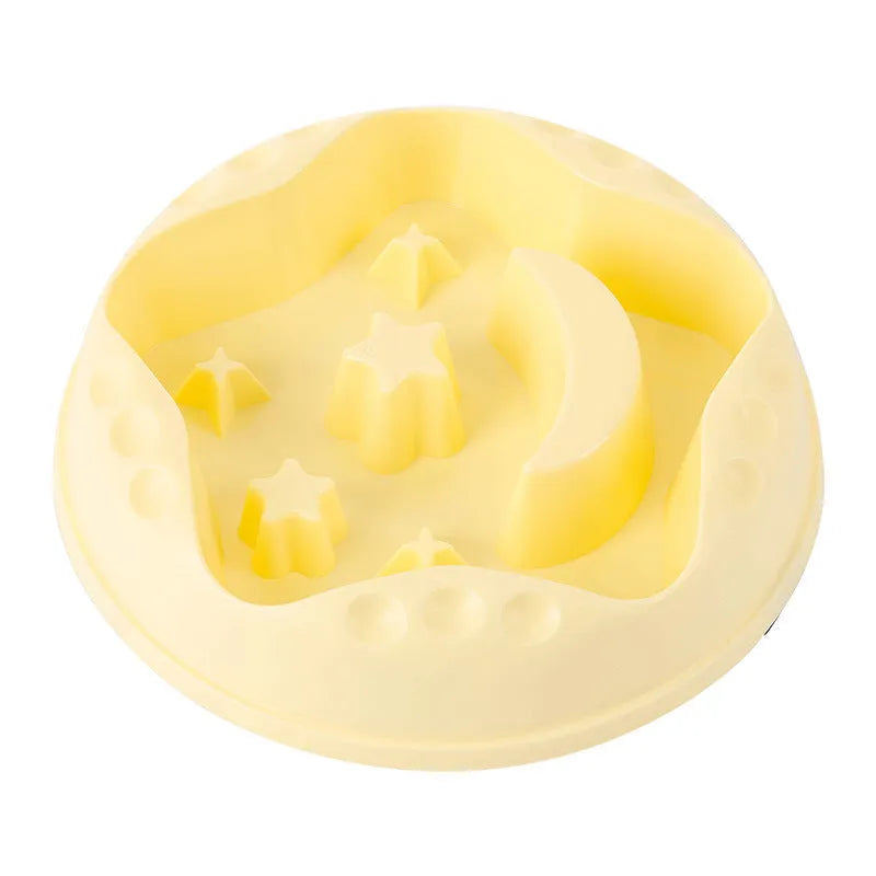 Blue slow feeder dog bowl with raised moon and star patterns inside, non-slip base