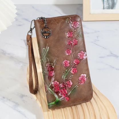 Chinese style embossed floral handbag with zip closure in black or brown colours