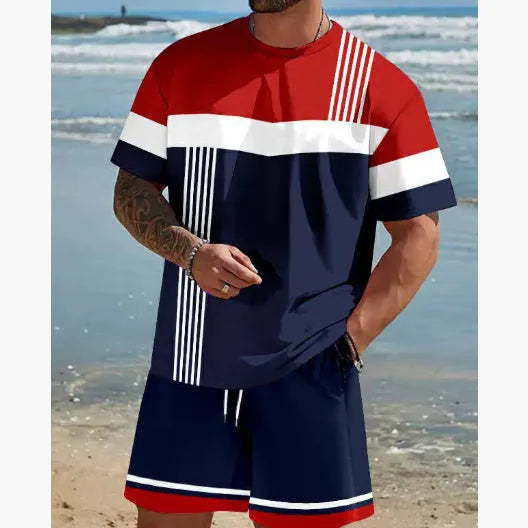 Man wearing a loose fit grey short-sleeved t-shirt and matching shorts from a summer leisure suit.