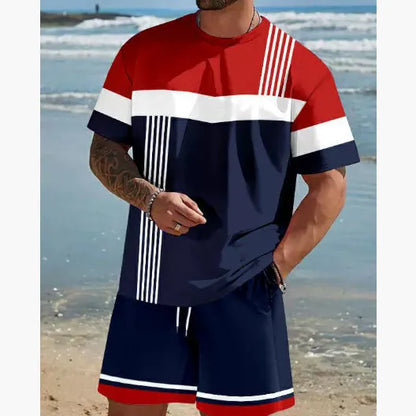 Man wearing a loose fit grey short-sleeved t-shirt and matching shorts from a summer leisure suit.