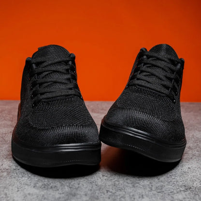 Light white and black unisex casual sports shoes with thick EVA sole and mesh upper, front lace-up.
