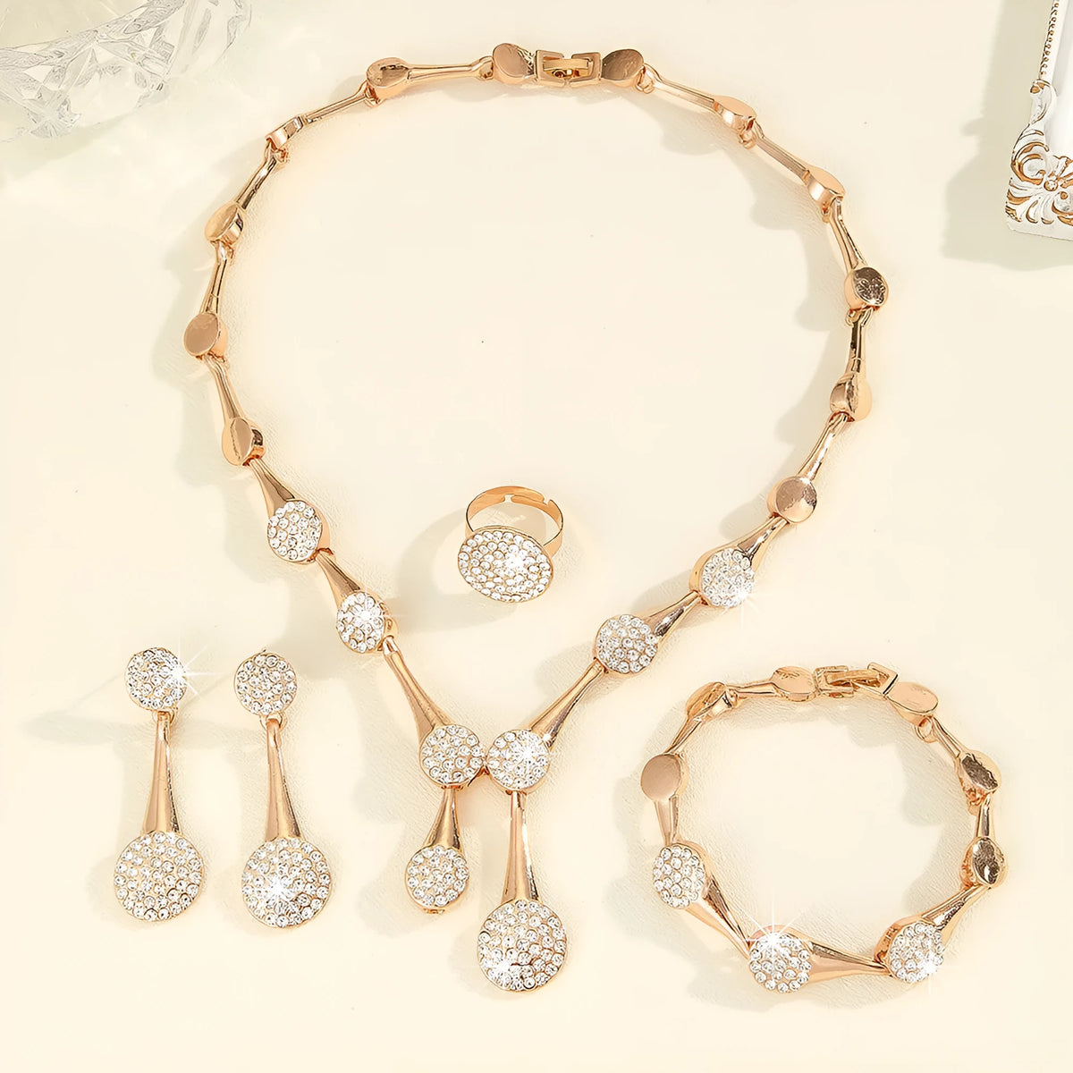 Gold tone alloy jewellery set with flower pendant necklace, bracelet and earrings in plant and flower pattern