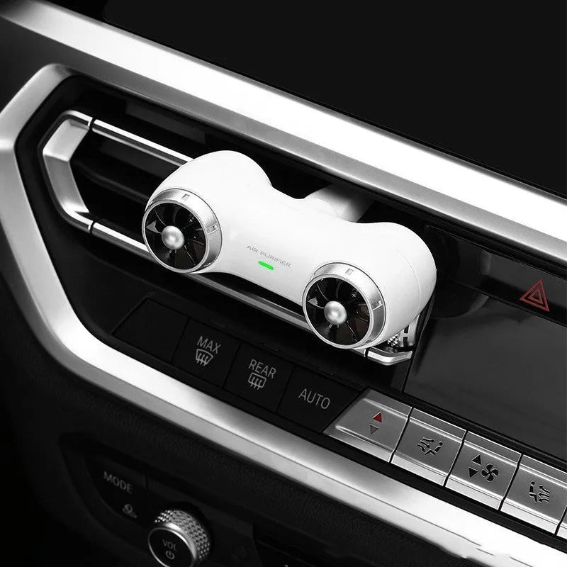 Compact black car anion air purifier with USB cable for formaldehyde removal and deodorising.
