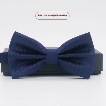 A solid colour pre-tied bow tie with an adjustable neck strap, shown in a classic flat head shape.