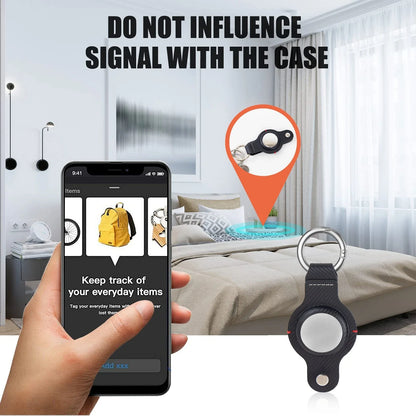 Premium PU leather AirTag keychain holder in black and grey colors for secure tracking of valuables