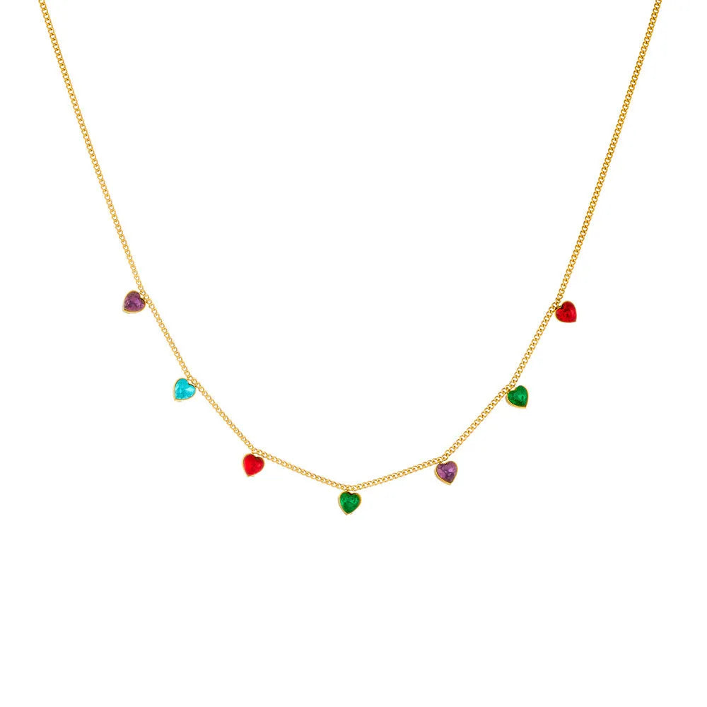 Women's gold-plated heart necklace with adjustable chain on white background