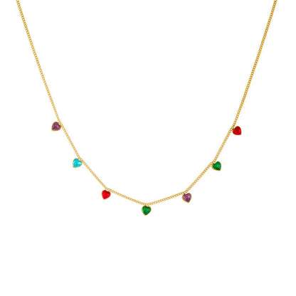 Women's gold-plated heart necklace with adjustable chain on white background