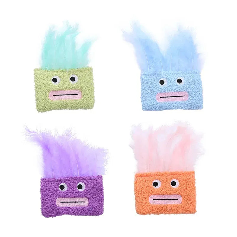 Colourful plush cat toy shaped like an explosion head with a large open mouth, shown in blue.