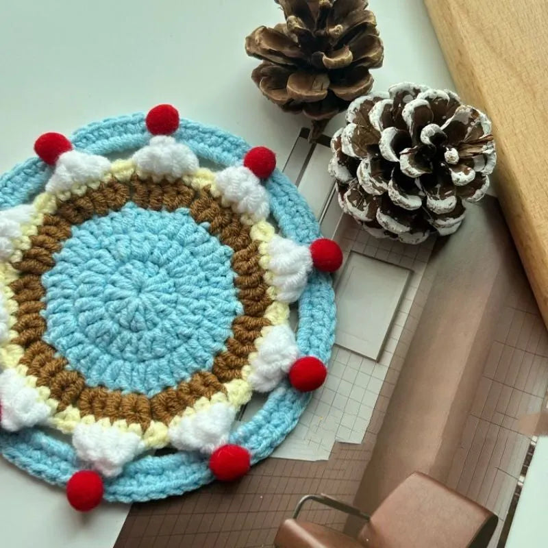 Finished wool crochet coaster bag with cake design measuring 9cm diameter
