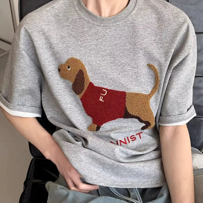 Men's black cotton T-shirt with embroidered sausage dog wrapped in a towel design
