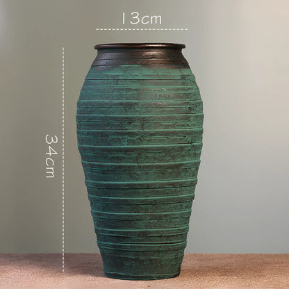 Ceramic mosaic vase with dried flower arrangement, handcrafted surface detailing