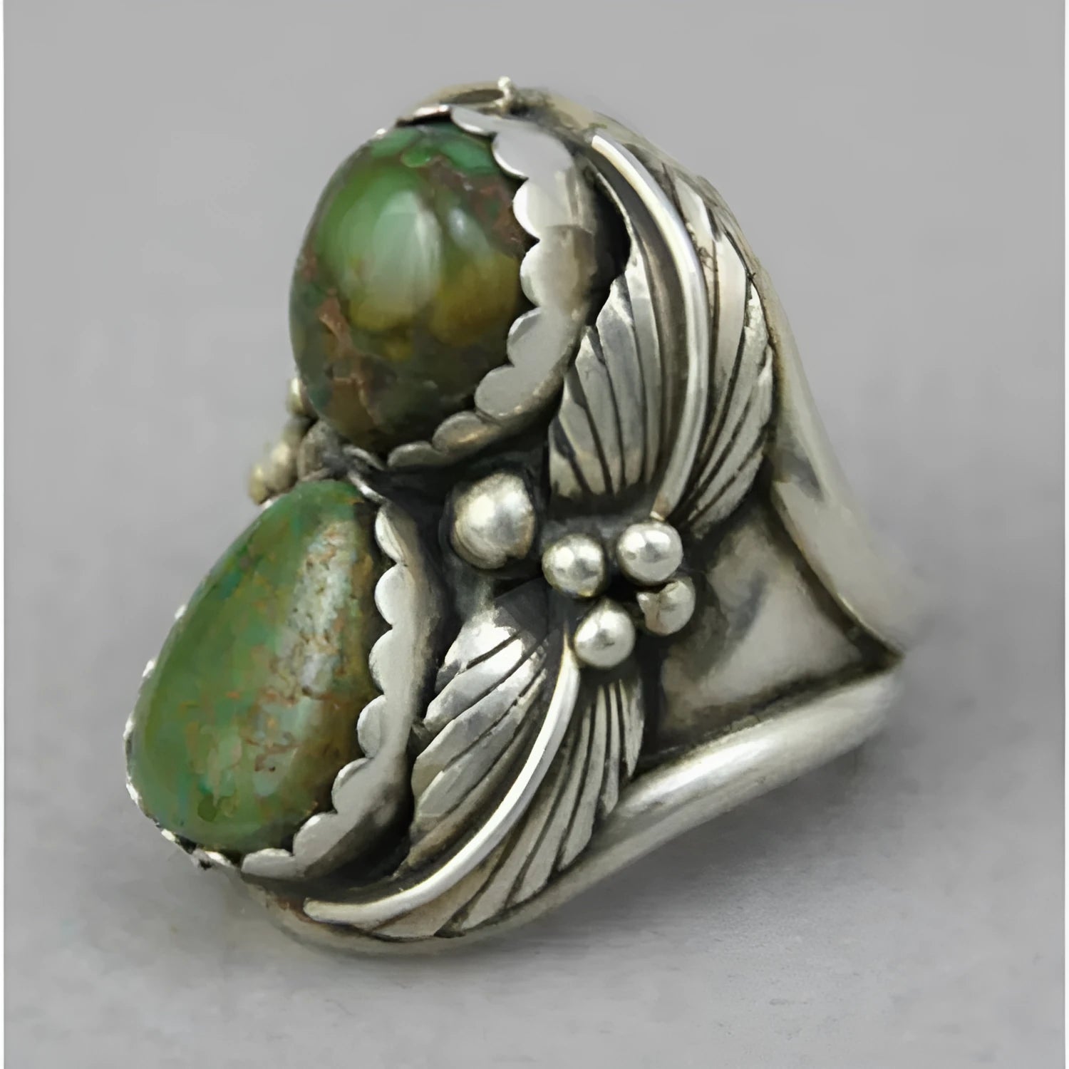 Turquoise geometric women's ring with inlaid detailing on alloy band, showing electroplated finish and structured design