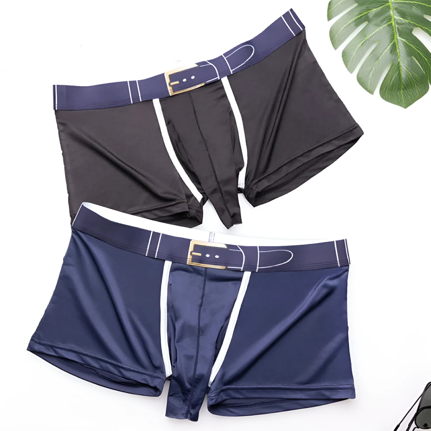Men's solid colour Ice Silk boxers in black, shown laid flat, with a mid waist design.