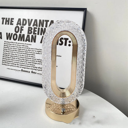 Modern minimalist O-shaped crystal desk lamp with touch dimming control on metal base