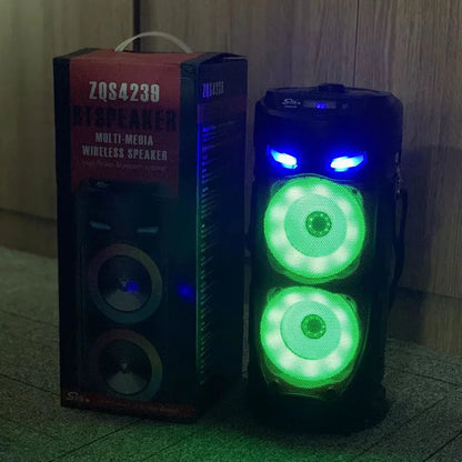 Black portable Bluetooth speaker with dual horn cannon design and wheat-coloured elements