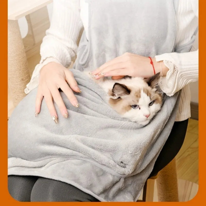 Beige plush pet carrier apron with adjustable neck strap and fresh air opening for small cat or dog