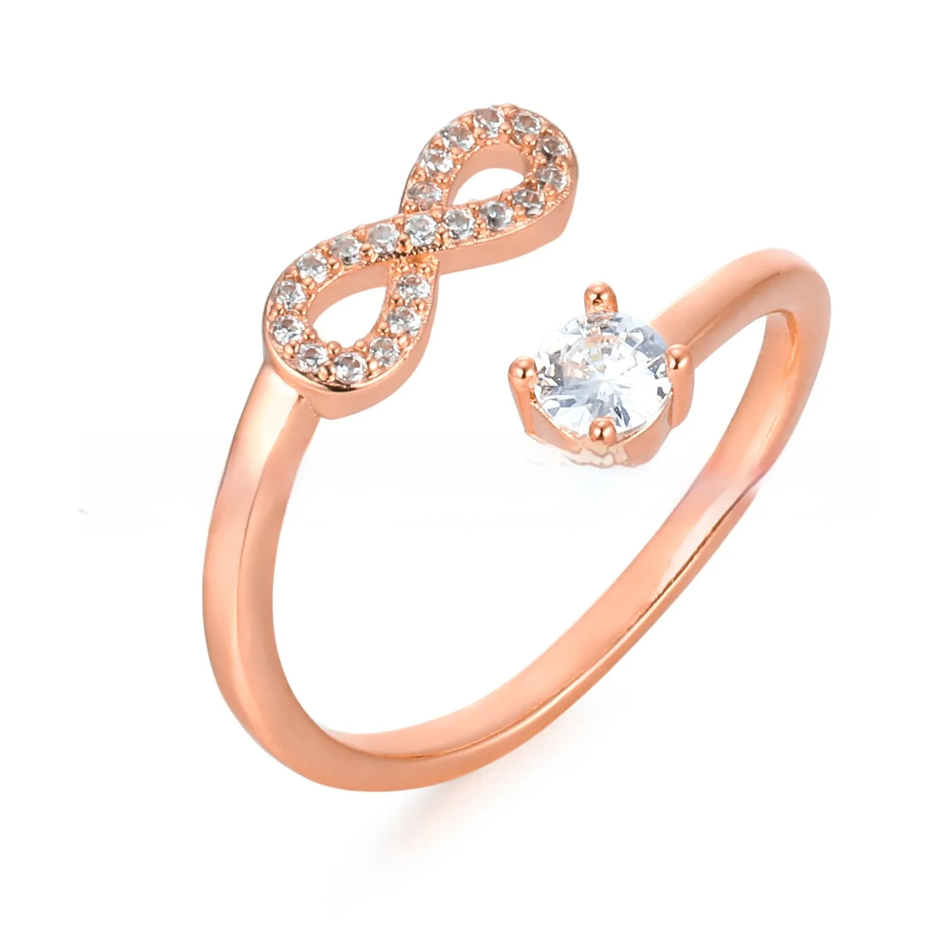 Open geometric ring with a zircon-encrusted letter 'A' in rose gold on a finger.