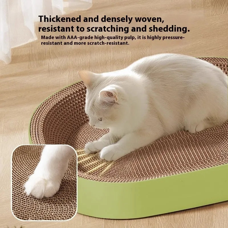 Green oval corrugated paper cat scratch board and nest bed measuring 55cm diameter
