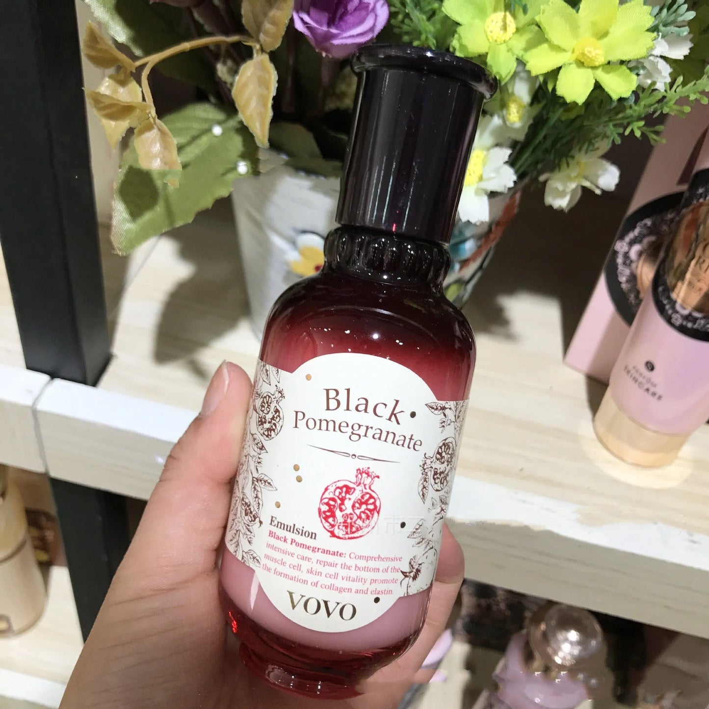 Six-piece pomegranate skin care set showing cleanser, milk, water, cream, essence, and eye cream products