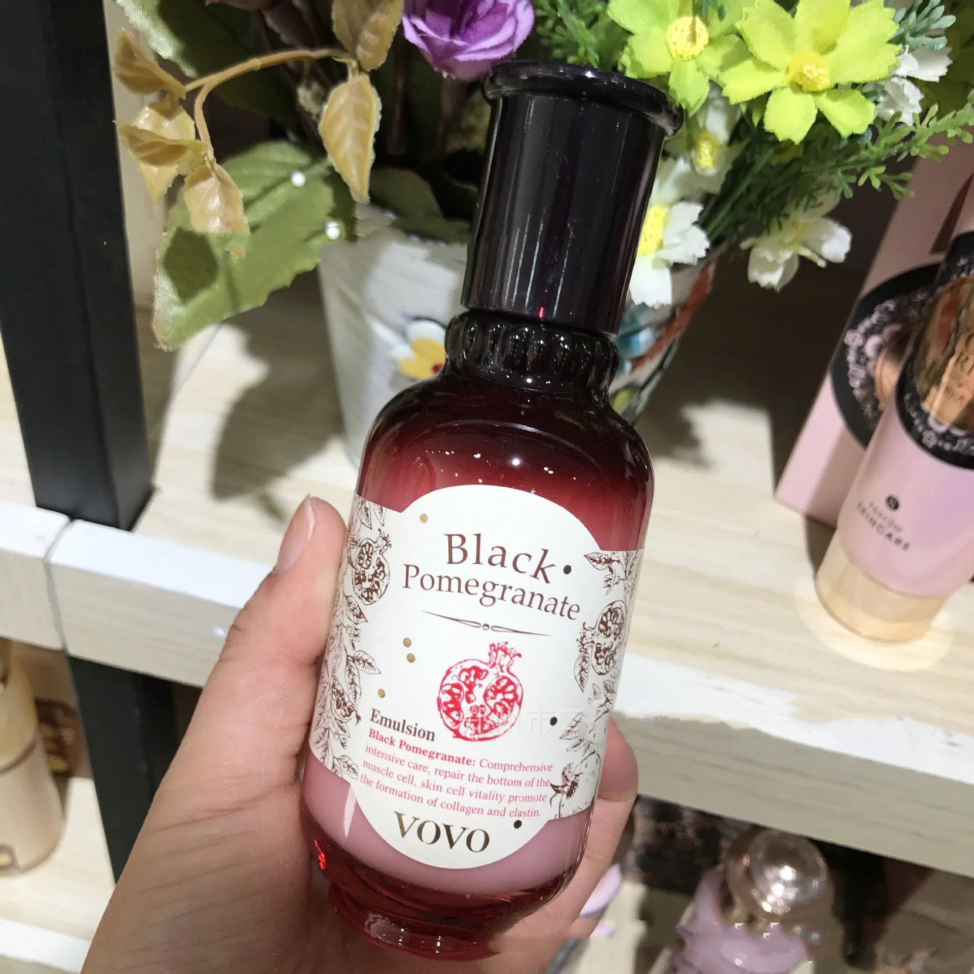 Six-piece pomegranate skin care set showing cleanser, milk, water, cream, essence, and eye cream products