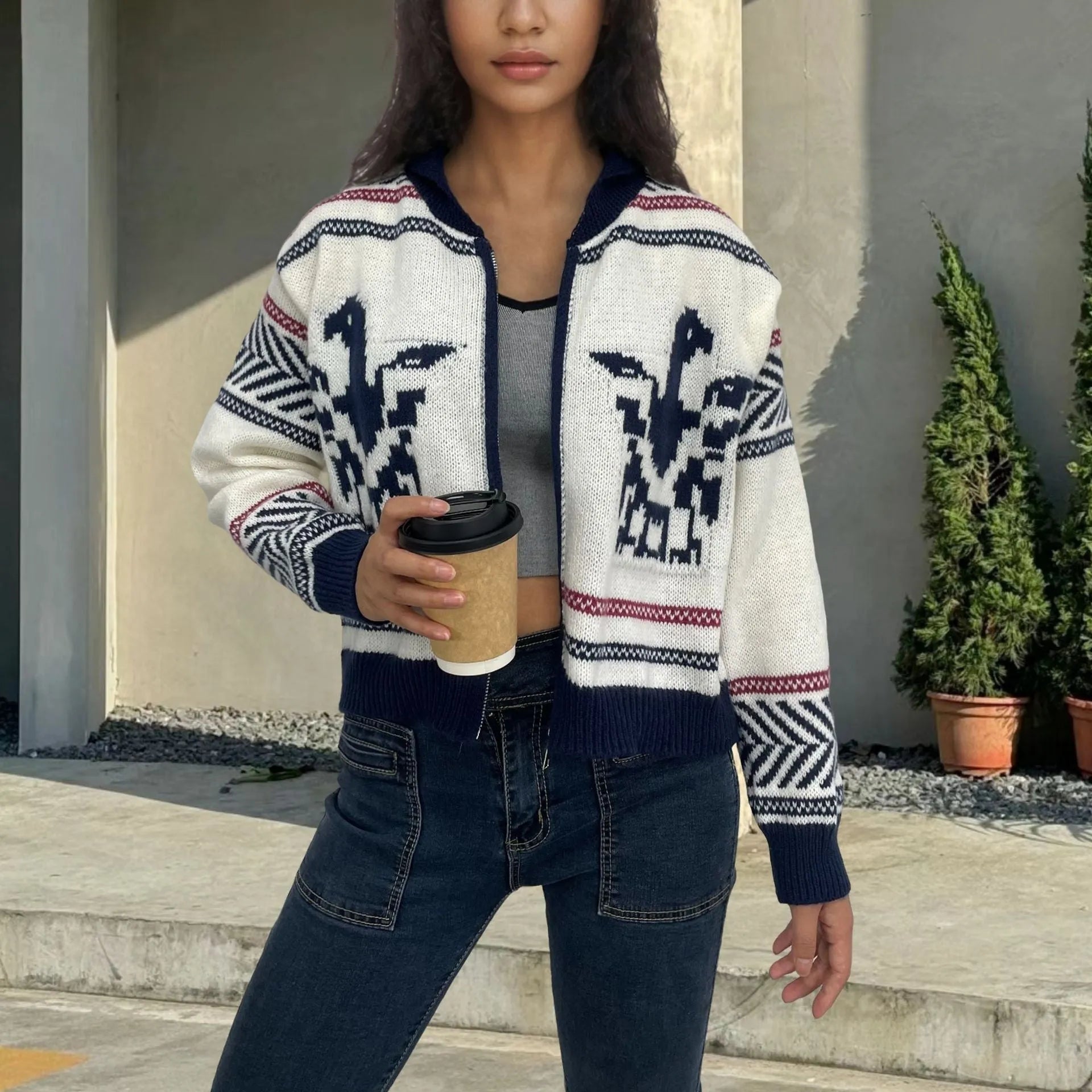 White women's wool zipper cardigan with contrasting jacquard stripe pattern on the front.