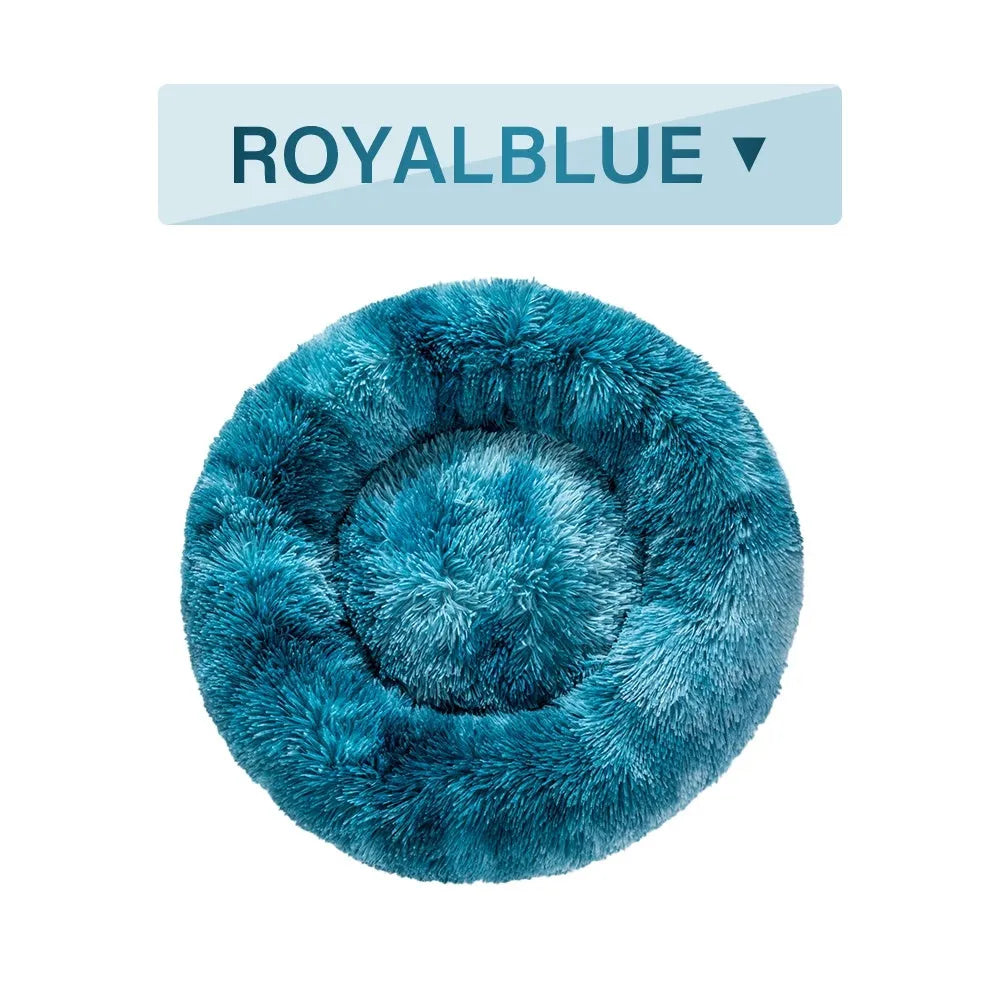 Fluffy donut-shaped pet bed with raised bolster edge in long plush material