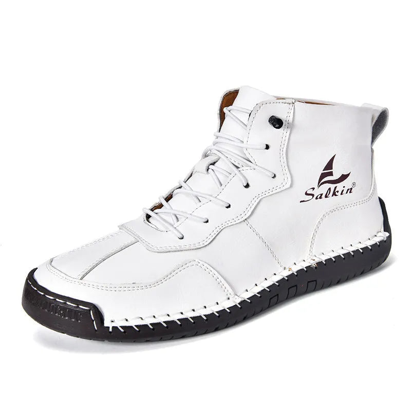 A pair of beige high-top casual boots with elastic band fastening and a flat rubber sole.