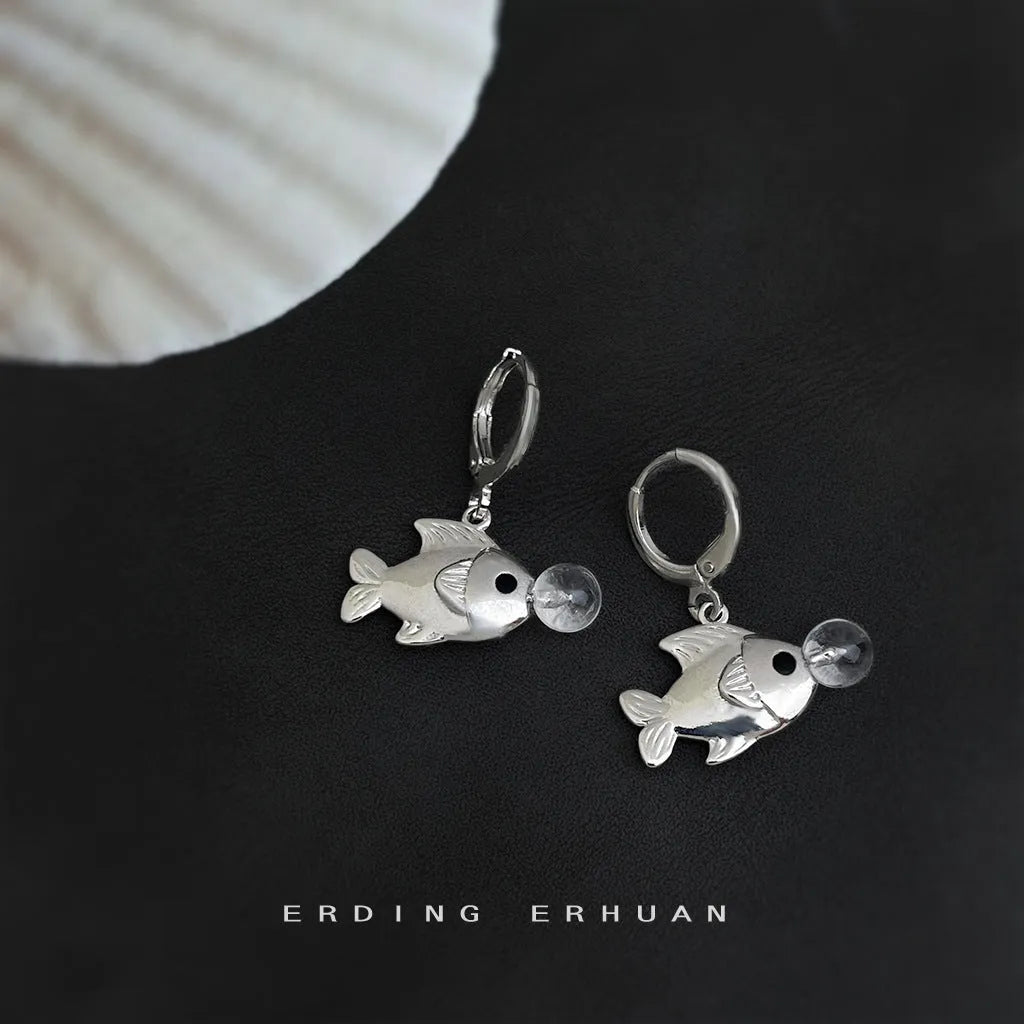 A pair of copper bubble fish earrings with electroplating, showing animal design in a sweet cool style.