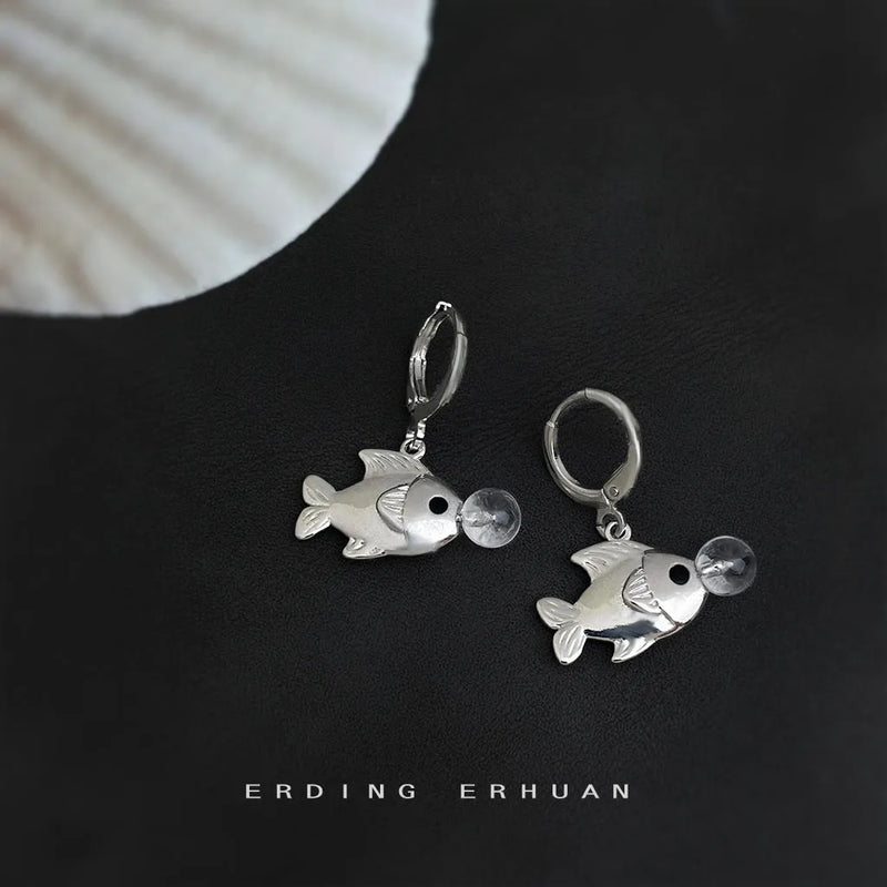 Fish earrings with an original design featuring a sweet cool style niche ins simple bubble fish motif, made from copper with electroplating treatment, presented as a pair of animal-themed personality earrings for women.