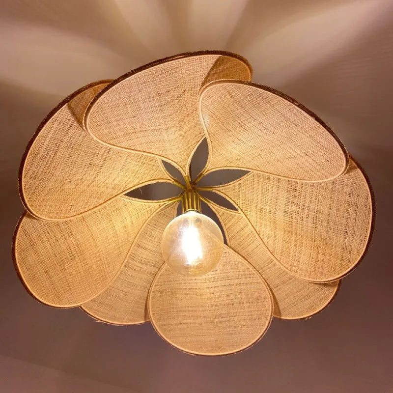 A cloth-craft hanging lamp in log wind Bohemian style, showing fabric texture and soft light diffusion.