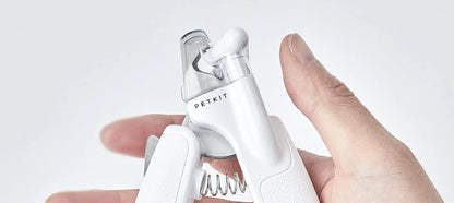 White LED pet nail clippers with a transparent safety guard and a nail file on a grey background.